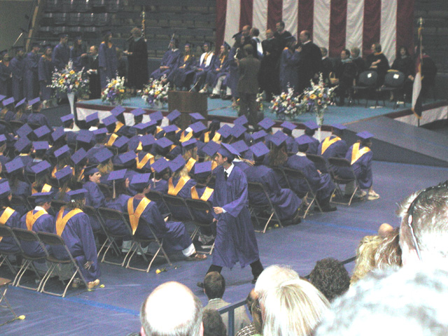 Brandon with diploma