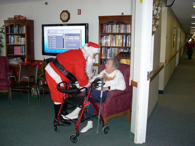 Dad and Marge play Santa and Mrs Claus