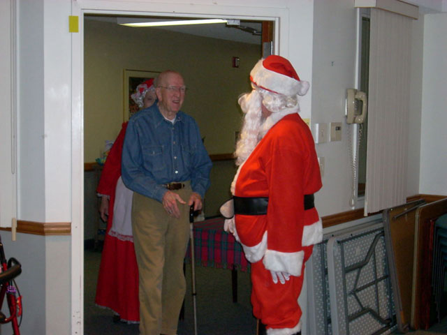 Dad and Marge play Santa and Mrs Claus