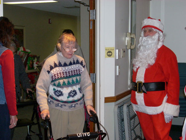 Dad and Marge play Santa and Mrs Claus