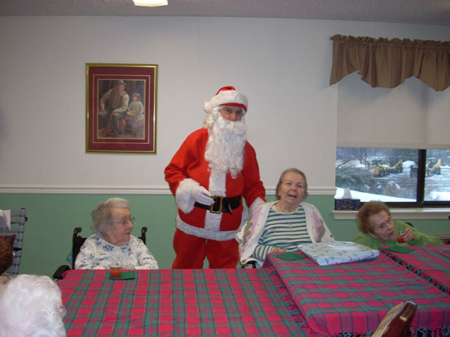 Dad and Marge play Santa and Mrs Claus